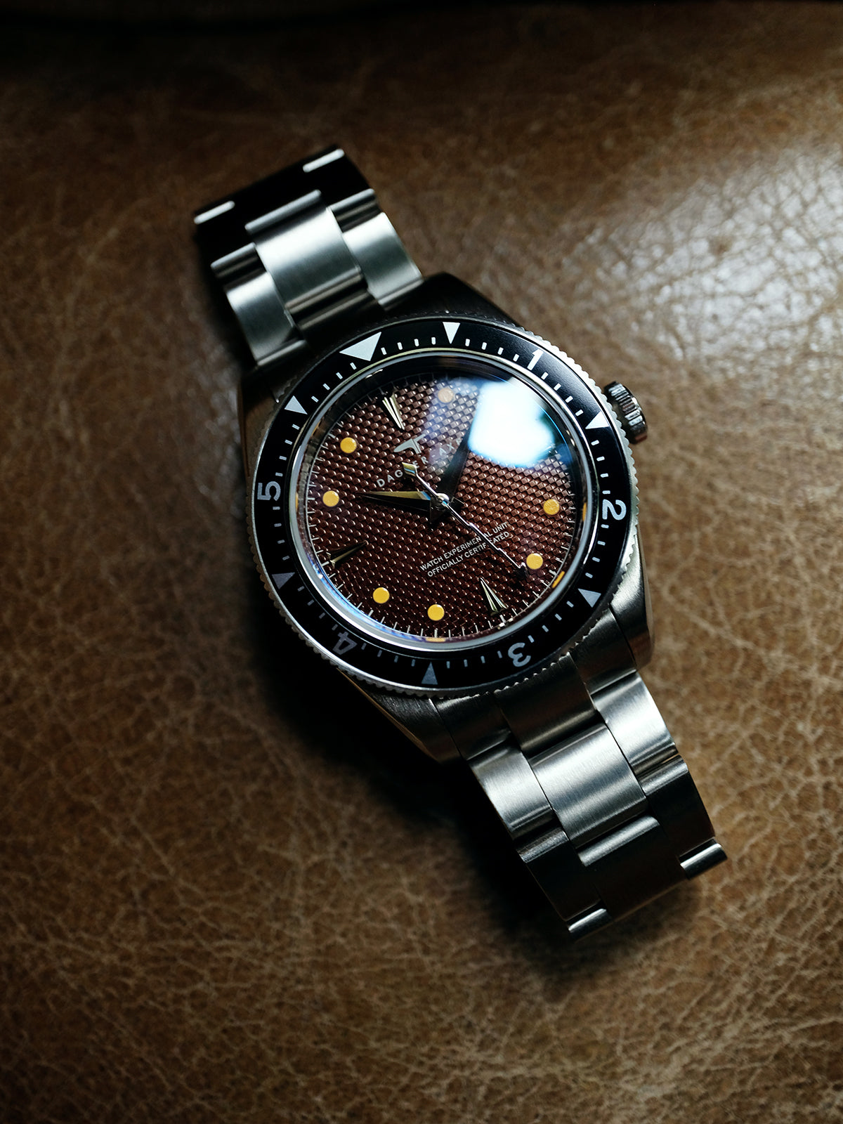 DAGGER A.X.E. Brown Dial watch close-up showing tropical brown dial and gold hour markers