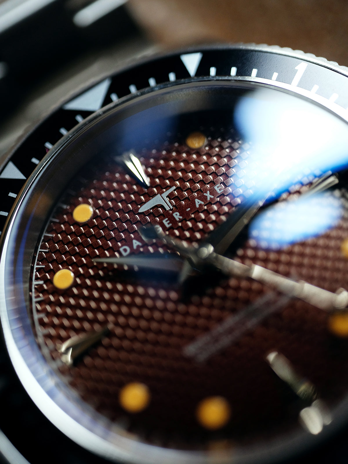 DAGGER A.X.E. Brown Dial screw-in crown detail showing 100m water resistance feature