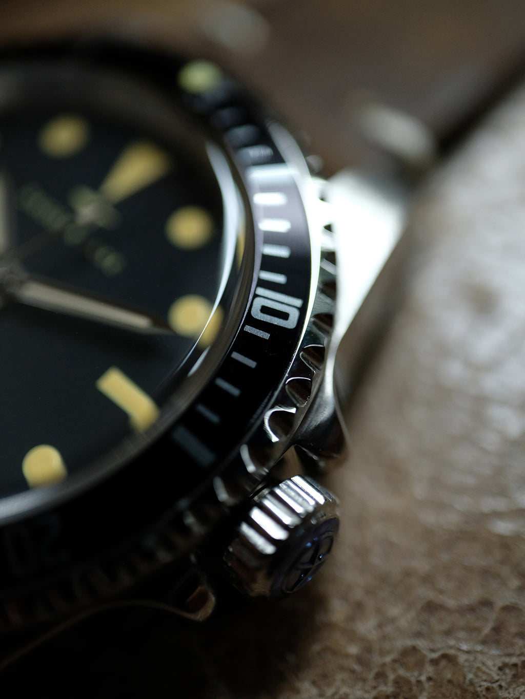 DAGGER A.X.E. MK1 vintage watch with stainless steel bracelet on dark background
