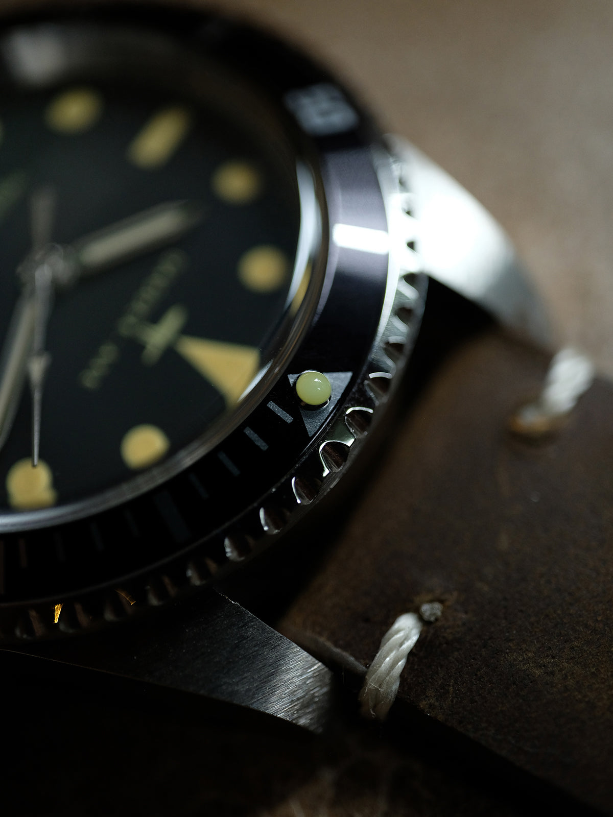 DAGGER A.X.E. MK1 watch dial detail showing applied hour markers and date window
